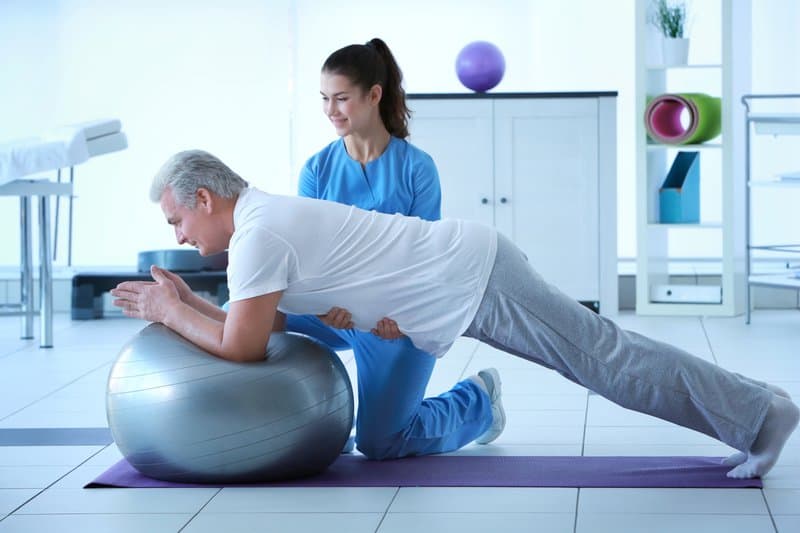 Physiotherapist providing personalized care to a patient at MidSouth Pain Treatment Center in Miramar, Hollywood, and Lauderdale Lakes FL.